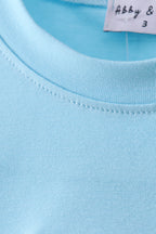 Blue cross applique top