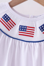 White flag smocked ruffle dress